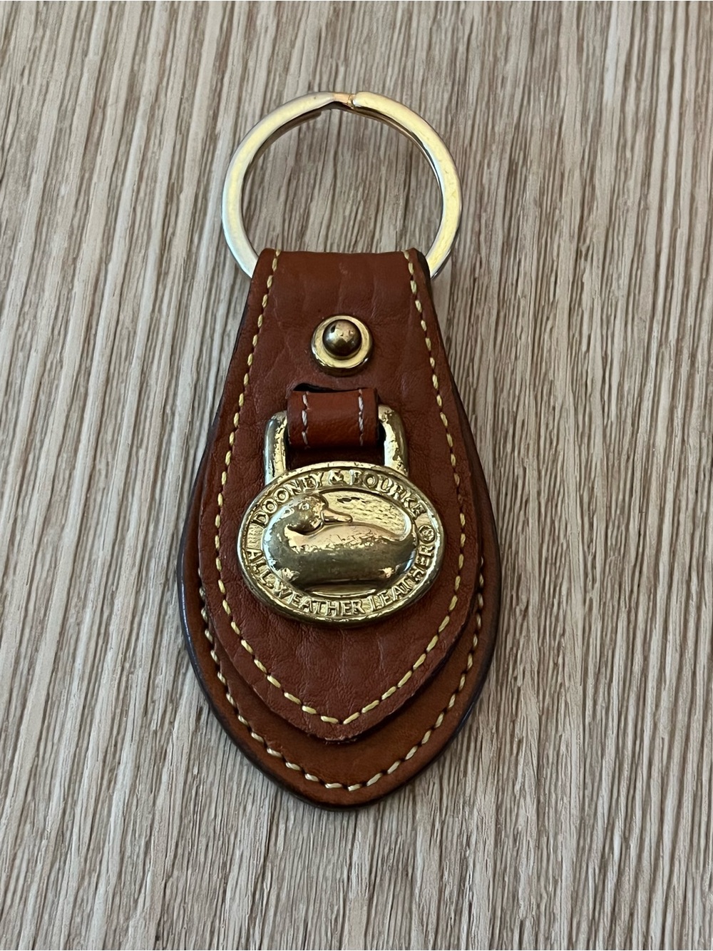 Dooney & Bourke Brown Leather Key Ring with Gold Tone Logo Medallion